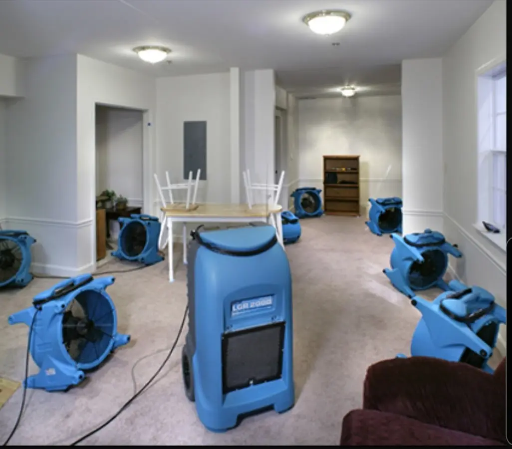 Air movers and dehumidifier setup for Water Damage Restoration in Colton